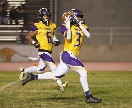 Tigers, 5-1 on the season, open WYL play with convincing 42-20 Friday night win over visiting Tulare Union No. 3 Kobe Green caught this 15-yard pass for a Lemoore touchdown.